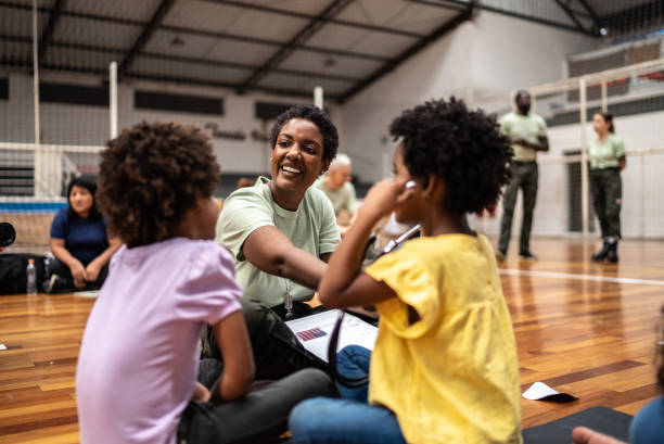 Army doctor playing with refugee children